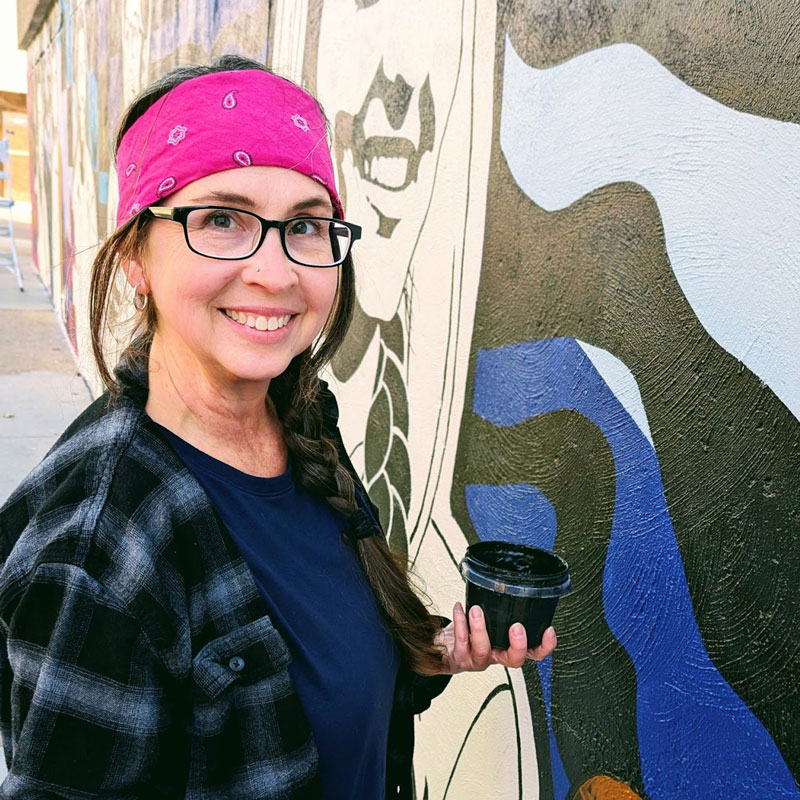 Phit Theta Kappa students work with artist Cherie Lee on a community mural project