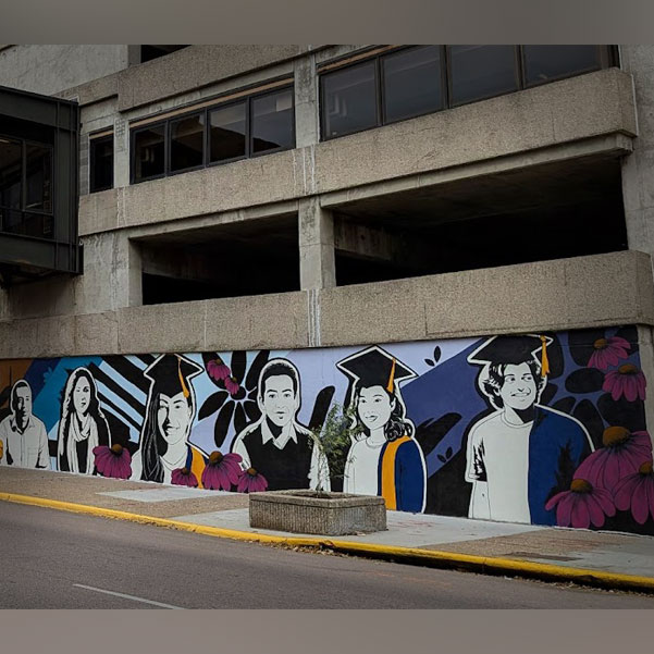 Phit Theta Kappa students work with artist Cherie Lee on a community mural project